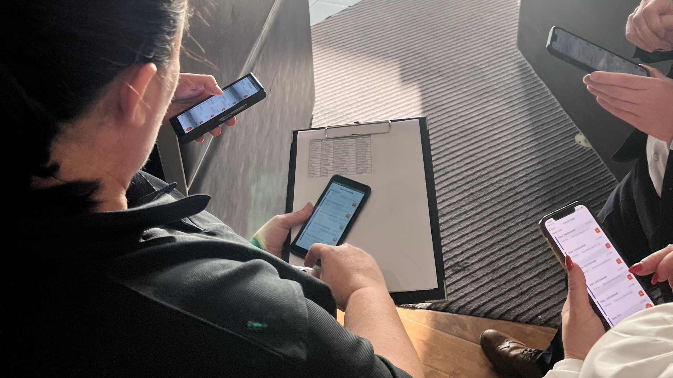 staff member holding a phone using firecloud365