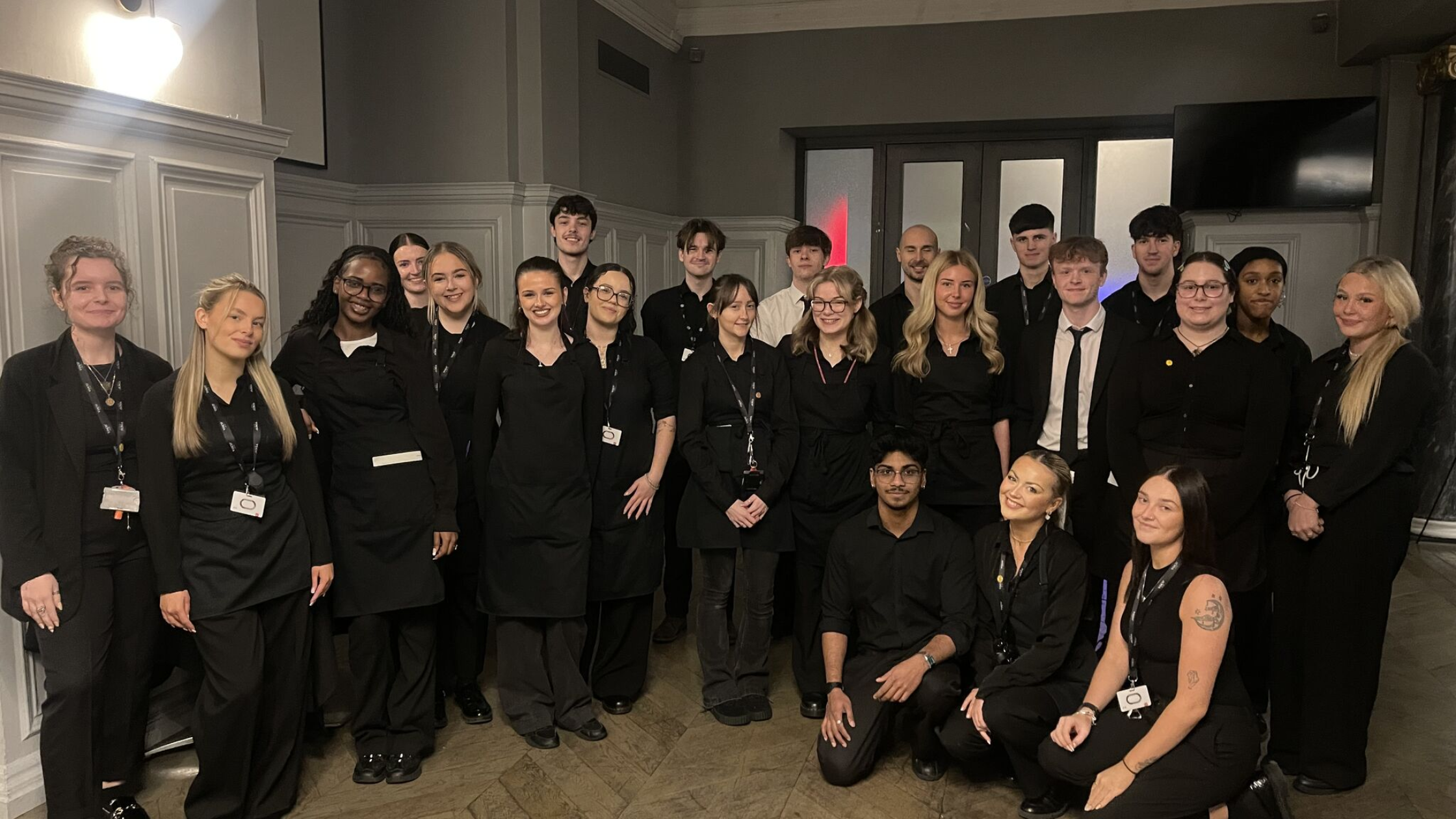 Hotel staff conducting fire safety checks in a calm